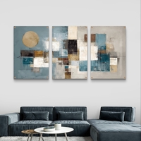 שלישיית תמונות זכוכית אבסטרקטיות בגווני תכלת, זהב ושמנת בעיצוב מודרני ויוקרתי לסלון