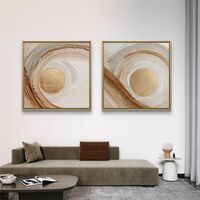זוג תמונות קנבס מרובעות בגווני שמנת, חום וזהב עם תנועת מעגלים מודרנית – תכשיט לבית