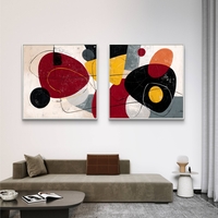 זוג תמונות קנבס מרובעות בסגנון אבסטרקט מודרני בגווני אדום, שחור וצהוב – תכשיט לבית