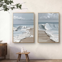 זוג תמונות קנבס גלי ים בגווני תכלת ולבן בעיצוב מודרני