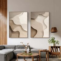 זוג תמונות קנבס בגווני בז ושמנת עם צורות אורגניות רכות
