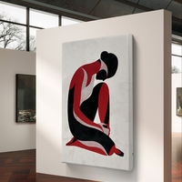 תמונת קנבס עם דמות נשית מינימליסטית בגווני שחור ואדום בעיצוב מודרני