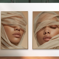 זוג תמונות קנבס של אישה עטופה בבד רך בגווני בז׳ חמים, מתוך קולקציית NEXTGEN BY BAR של תכשיט לבית – עיצוב אמנותי רך ומלא שלווה.