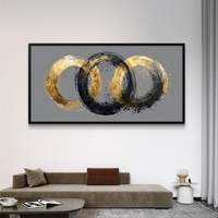 תמונה לסלון בגווני זהב ושחור – קומפוזיציית עיגולים אבסטרקטית על רקע אפור בטון