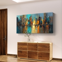 תמונת קנבס אבסטרקטית לרוחב עם קו רקיע עירוני והשתקפות מים בגווני כחול, טורקיז וזהב