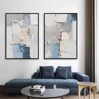 זוג תמונות קנבס אבסטרקט בגווני לבן, אפור וכחול בעיצוב מודרני – הדפסה חלקה ללא תבליט.
