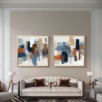 תמונות קנבס מודרניות מרובעות עם צורות גיאומטריות בצבעי כחול וכתום חמרה