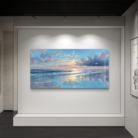 תמונת זכוכית לרוחב של שקיעה מעל הים עם השתקפות מים בגווני כחול וזהב בעיצוב יוקרתי