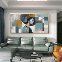 תמונת קנבס של דיוקן אישה עם רקע גיאומטרי בגווני כחול וזהב