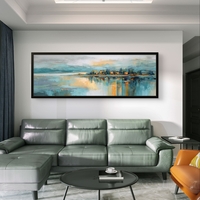 תמונת קנבס פנורמית אבסטרקטית עם קו אופק, השתקפות מים וגווני כחול, תכלת וזהב בעיצוב רגוע ויוקרתי