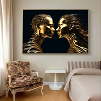תמונת קנבס לרוחב עם שתי דמויות זהובות סימטריות על רקע שחור בעיצוב מודרני ויוקרתי