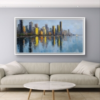 תמונת קנבס לרוחב של קו רקיע עירוני עם השתקפות במים בגווני כחול וזהב, לעיצוב סלון מודרני ואלגנטי