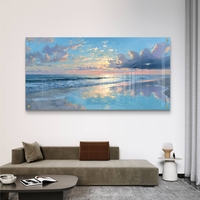 תמונת זכוכית לרוחב של שקיעה מעל הים עם השתקפות מים בגווני כחול וזהב בעיצוב יוקרתי