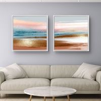 זוג תמונות קנבס מרובעות בגווני פסטל עדינים המדמים שקיעה רגועה – תכשיט לבית