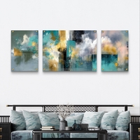 תמונת זכוכית מחולקת אבסטרקטית בגווני טורקיז, אפור וזהב בעיצוב מודרני