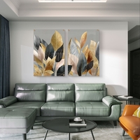 תמונת זכוכית זוגית עם עלים בגווני זהב, שמנת ושחור בעיצוב אלגנטי ומודרני