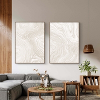 זוג תמונות קנבס עם קווים זורמים בגווני בז ושמנת