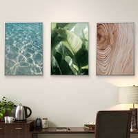 שלישיית תמונות קנבס בעיצוב טבעי – מים צלולים, עלים ירוקים ועץ בגוון בז’, מהקולקציה של תכשיט לבית, NEXTGEN BY BAR.