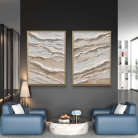 סט תמונות קנבס זוגיות בגווני שמנת ובז’ בעיצוב שכבות טבעיות ומינימליסטיות