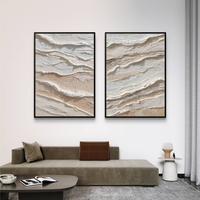 סט תמונות קנבס זוגיות בגווני שמנת ובז’ בעיצוב שכבות טבעיות ומינימליסטיות