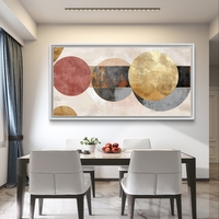 תמונת קנבס לרוחב בעיצוב אבסטרקטי עם מעגלים חופפים בגווני שמנת, זהב ואפור על רקע בהיר.