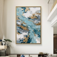 תמונת קנבס אבסטרקטית בגווני תכלת, כחול ולבן עם נגיעות זהב בעיצוב יוקרתי ואלגנטי לבית