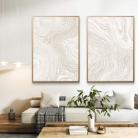 זוג תמונות קנבס עם קווים זורמים בגווני בז ושמנת