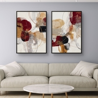 סט תמונות קנבס זוגיות אבסטרקטיות בגווני בורדו, זהב ושמנת עם קווים דינמיים ועיצוב מודרני