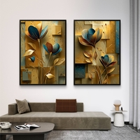 זוג תמונות קנבס פרחוניות בגווני זהב וכחול – דגם DA2223