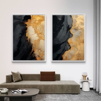 תמונת קנבס זוגית אבסטרקטית בגווני שחור וזהב בעיצוב יוקרתי לסלון