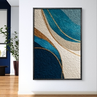 תמונת קנבס מופשטת בגווני כחול וזהב עם קווים זורמים והדפסה חלקה