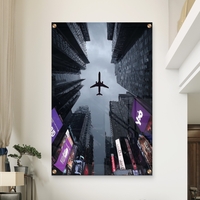 תמונת זכוכית של מטוס חולף מעל גורדי שחקים במראה אורבני דרמטי – NEXTGEN BY BAR