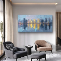 תמונת קנבס של קו רקיע עירוני בגווני כחול וזהב עם השתקפות במים