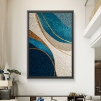 תמונת קנבס מופשטת בגווני כחול וזהב עם קווים זורמים והדפסה חלקה