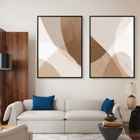 זוג תמונות קנבס בגווני בז׳, חום וקרם, בעיצוב מופשט עם קווים רכים והרמוניים, הדפסה חלקה ואיכותית מבית תכשיט לבית – NEXTGEN BY BAR.