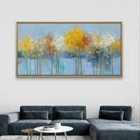 תמונת קנבס של עצים עדינים בגווני תכלת, צהוב ולבן על רקע בהיר