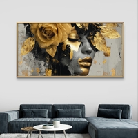 תמונת קנבס לרוחב עם דיוקן נשי דרמטי בגווני שחור וזהב ועיטורי עלי זהב