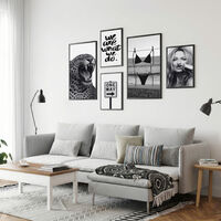 סט קנבס חמישה חלקים בשחור לבן עם טקסט השראה, דימויים אורבניים ונוכחות נשית בעיצוב מודרני לסלון