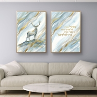 תמונת קנבס זוגית בהדפסה חלקה עם אייל בצבעי תכלת וזהב ופסוק קדוש בעברית, עיצוב רוחני ועדין לבית.