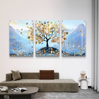 תמונת זכוכית שלישייה עם עץ ועלים בגווני תכלת וזהב על רקע הרים בעיצוב רגוע