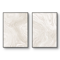 זוג תמונות קנבס עם קווים זורמים בגווני בז ושמנת