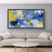 תמונת קנבס אבסטרקטית לרוחב בגווני כחול וצהוב עם שכבות צבע ותנועת מכחול מודרנית