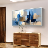 תמונת קנבס לרוחב בעיצוב אבסטרקטי עם מריחות צבע בגווני כחול, שמנת וחול, בסגנון מודרני ורגוע
