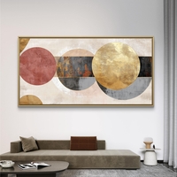 תמונת קנבס לרוחב בעיצוב אבסטרקטי עם מעגלים חופפים בגווני שמנת, זהב ואפור על רקע בהיר.