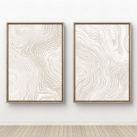 זוג תמונות קנבס עם קווים זורמים בגווני בז ושמנת