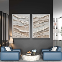 סט תמונות קנבס זוגיות בגווני שמנת ובז’ בעיצוב שכבות טבעיות ומינימליסטיות