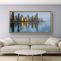 תמונת קנבס לרוחב של קו רקיע עירוני עם השתקפות במים בגווני כחול וזהב, לעיצוב סלון מודרני ואלגנטי