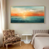 תמונת קנבס לרוחב עם שקיעה אבסטרקטית מעל הים בגווני תכלת, כתום וחול בעיצוב רגוע ואלגנטי
