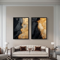 תמונת קנבס זוגית אבסטרקטית בגווני שחור וזהב בעיצוב יוקרתי לסלון