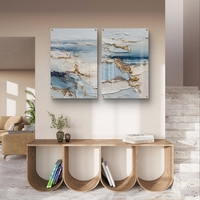 תמונת זכוכית זוגית אבסטרקטית בגווני שמנת, תכלת וכחול עם נגיעות זהב, הדפסה חלקה ללא תבליט